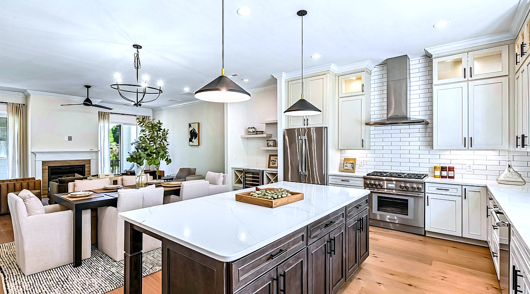 expansive kitchen with dinner and living room in the back