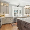 massive, open kitchen with pendant lights over large island